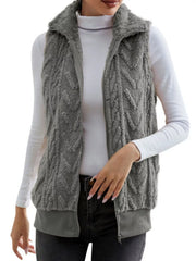 Dark gray faux fur zip-up vest with chevron texture and ribbed hem