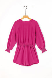 Cerise tie-front blouson sleeve playsuit with elastic waist and smocked cuffs.