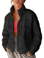 Black quilted bomber jacket with stand collar and zip closure.
