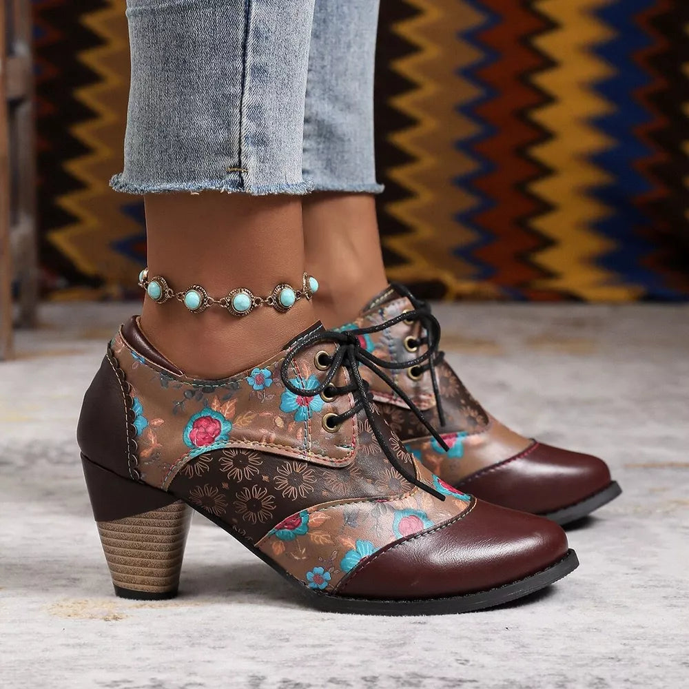 Floral patchwork lace-up ankle boots in dark brown with a block heel.