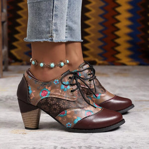 Floral patchwork lace-up ankle boots in dark brown with a block heel.