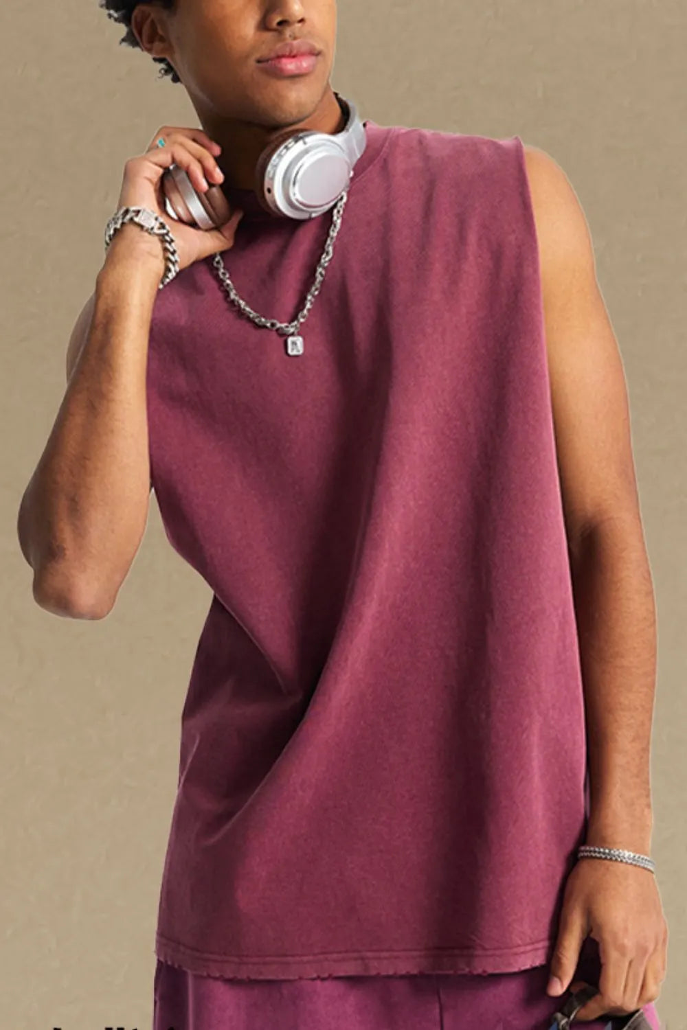 Burgundy washed cotton muscle tank top with a relaxed fit and raw hem.