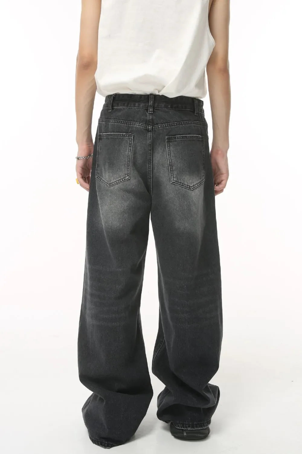 Oversized wash denim trousers in charcoal grey with a baggy fit and classic five-pocket styling.