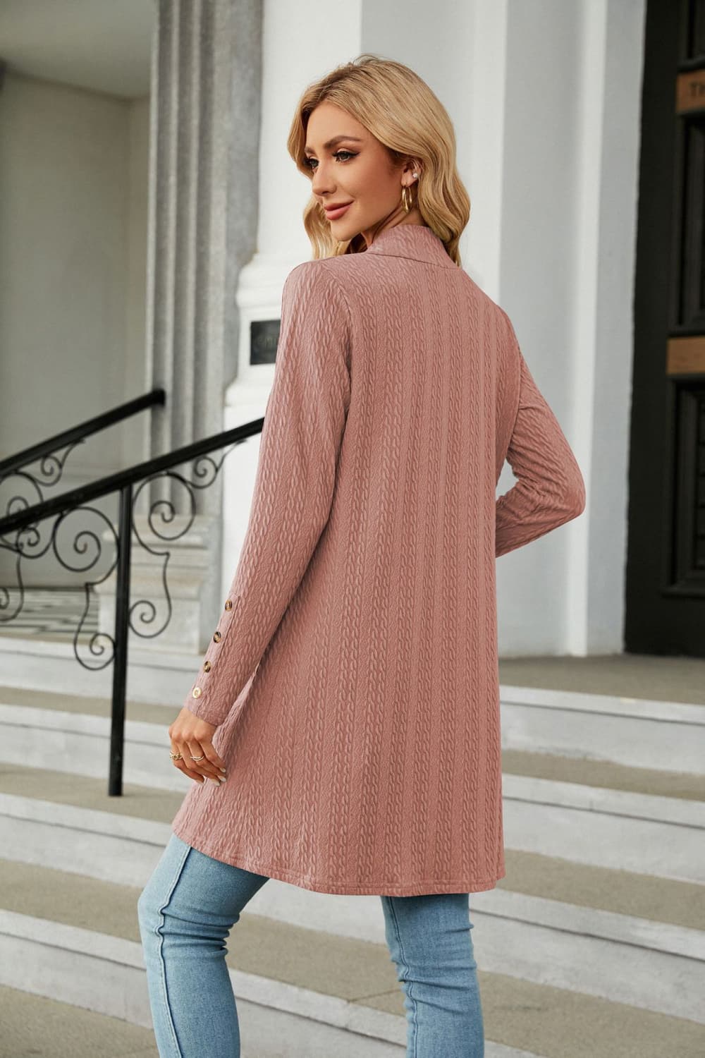 Dusty pink textured knit open-front duster cardigan with button detail on sleeves.