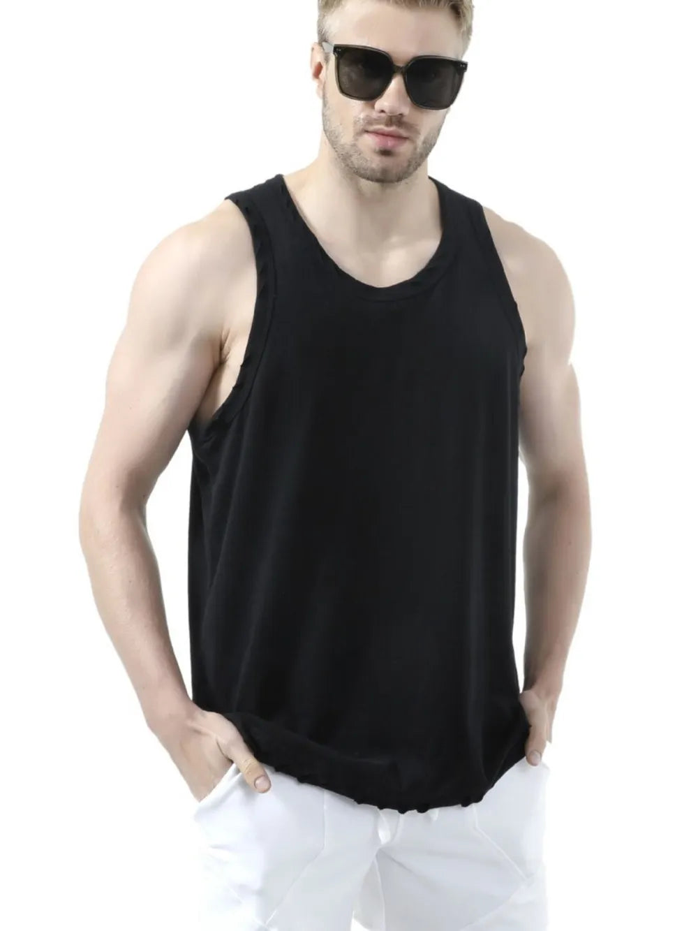 Black relaxed fit tank top with raw edge detail and scoop neck.