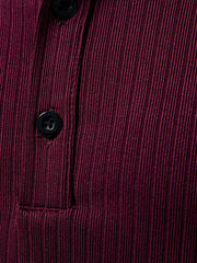 Burgundy ribbed henley t-shirt with black buttons and visible stitching detail.