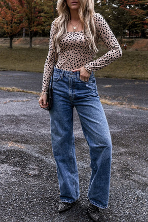 Spotted scoop neck long sleeve bodysuit in Dust Storm, styled with high-waisted jeans.