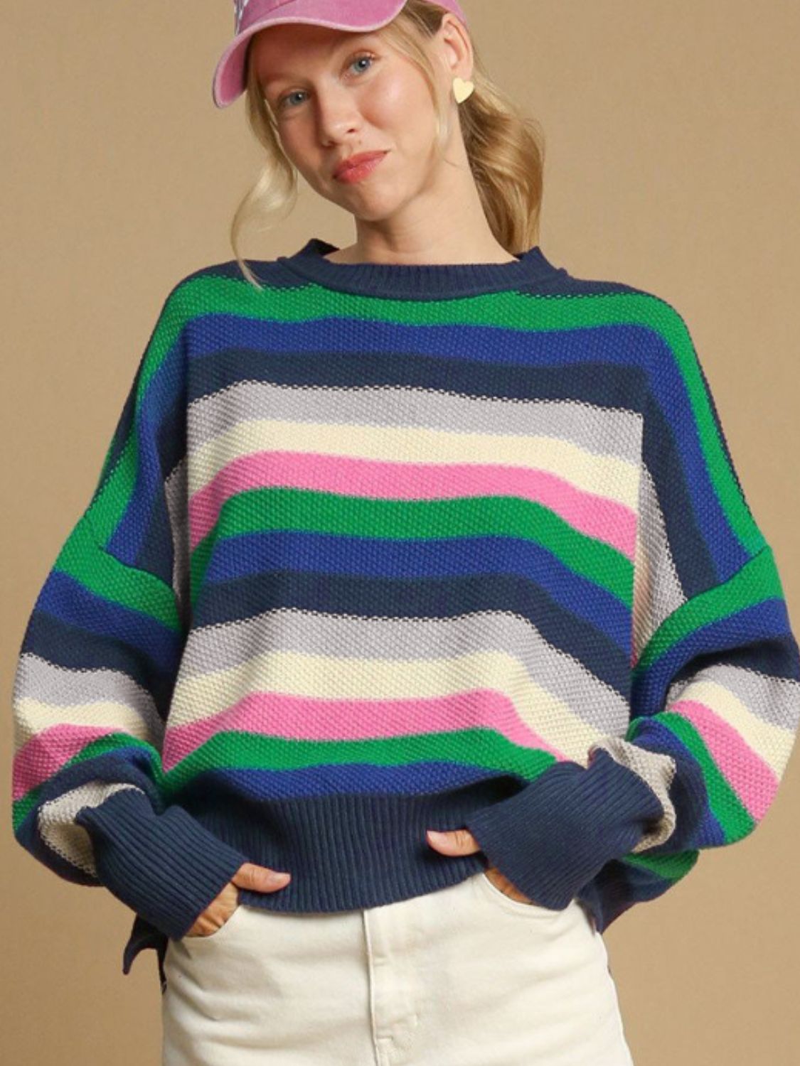 Chunky knit crewneck sweater with colorful horizontal stripes in green, blue, pink, and cream.