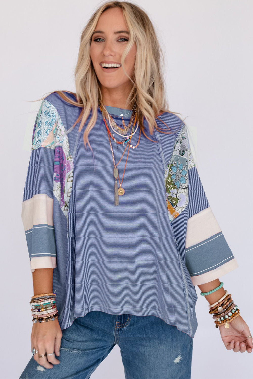 Patchwork stripe raglan sleeve tee in dusty blue with artistic boho print panels.
