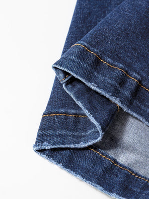 Medium wash denim wide-leg jeans with frayed hem detail and contrast stitching.