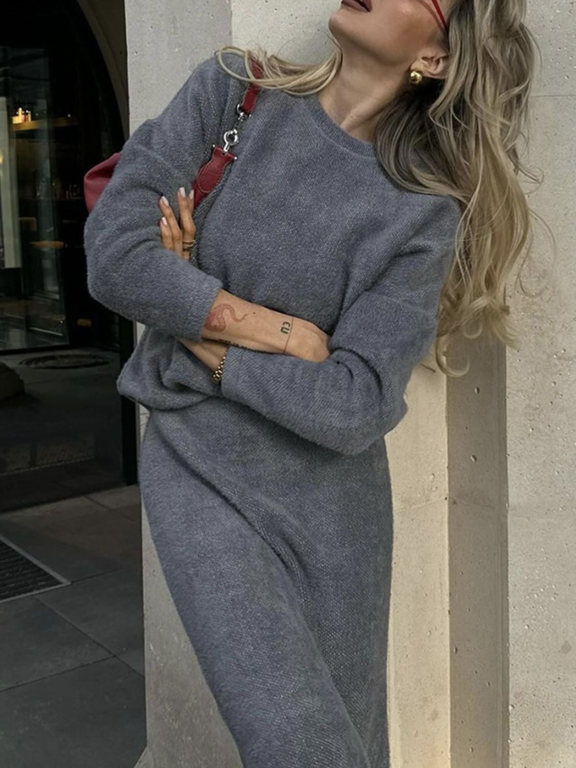 Dark gray textured knit co-ord set with relaxed fit sweater and pants.