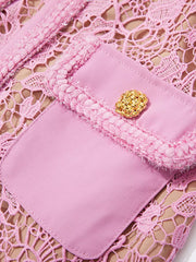 Pink lace midi dress with pocket detail and gold button.