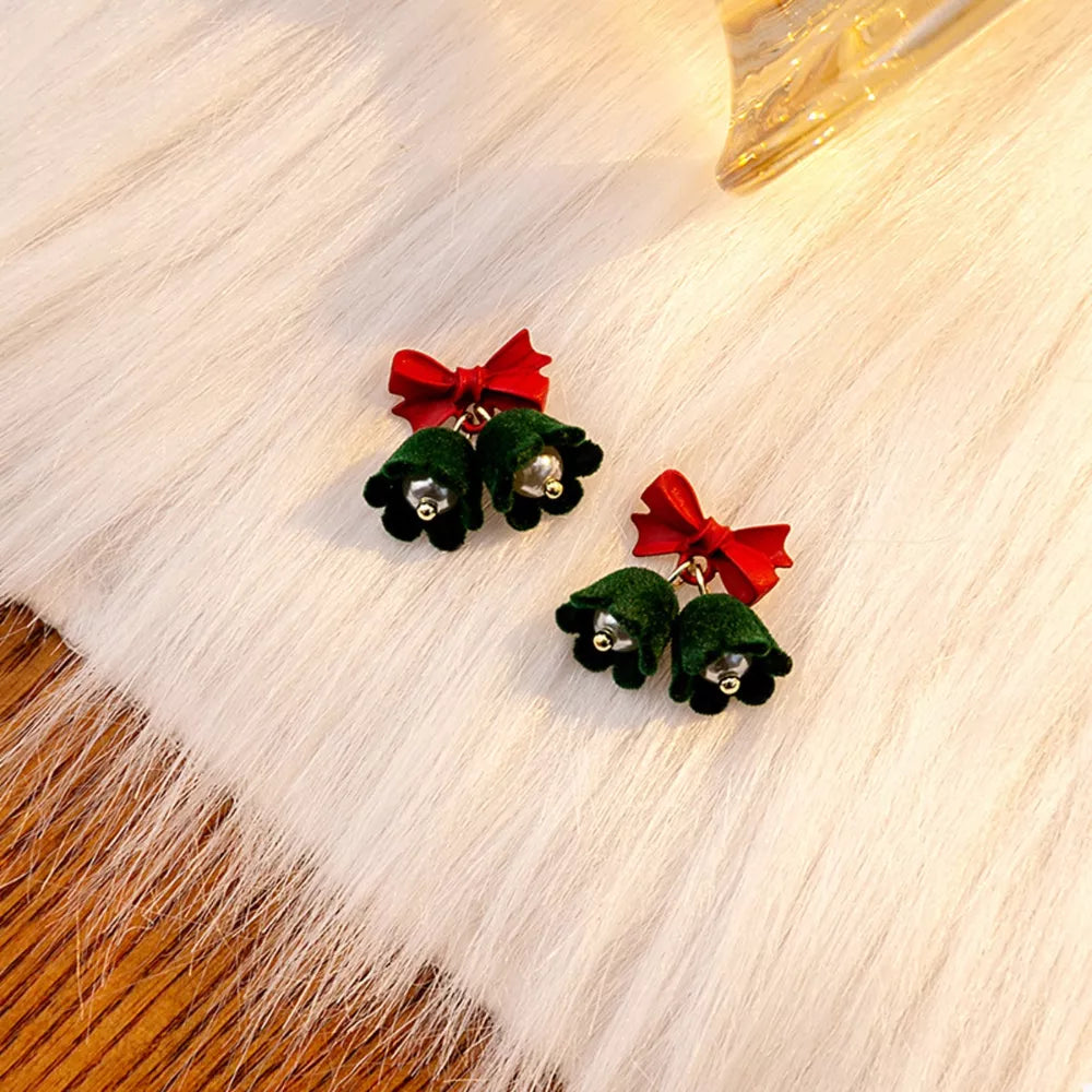 Velvet bell earrings in dark green with red bows
