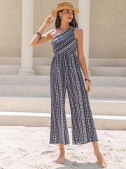 Printed asymmetric palazzo jumpsuit with one shoulder, wide leg, and black and white pattern.