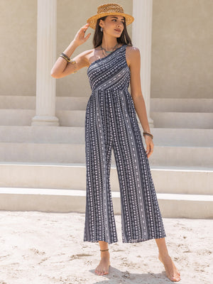 Printed asymmetric palazzo jumpsuit with one shoulder, wide leg, and black and white pattern.