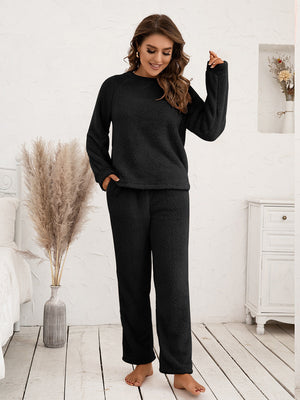 Black plush loungewear set with raglan sleeves and elastic waist pants.