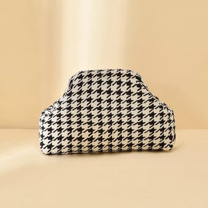 Vibrant knit clutch with houndstooth pattern in black and white