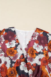 Floral wrap mini dress with V-neck and puff sleeves in a multicolor floral print.