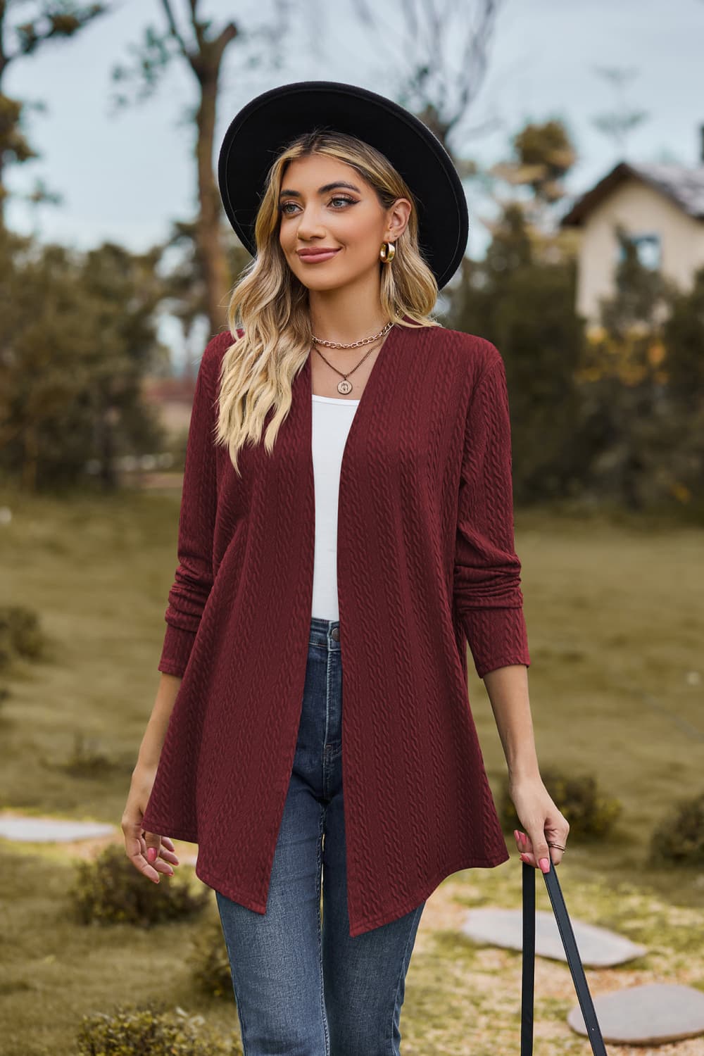 Burgundy textured knit cardigan with drape front and long sleeves.