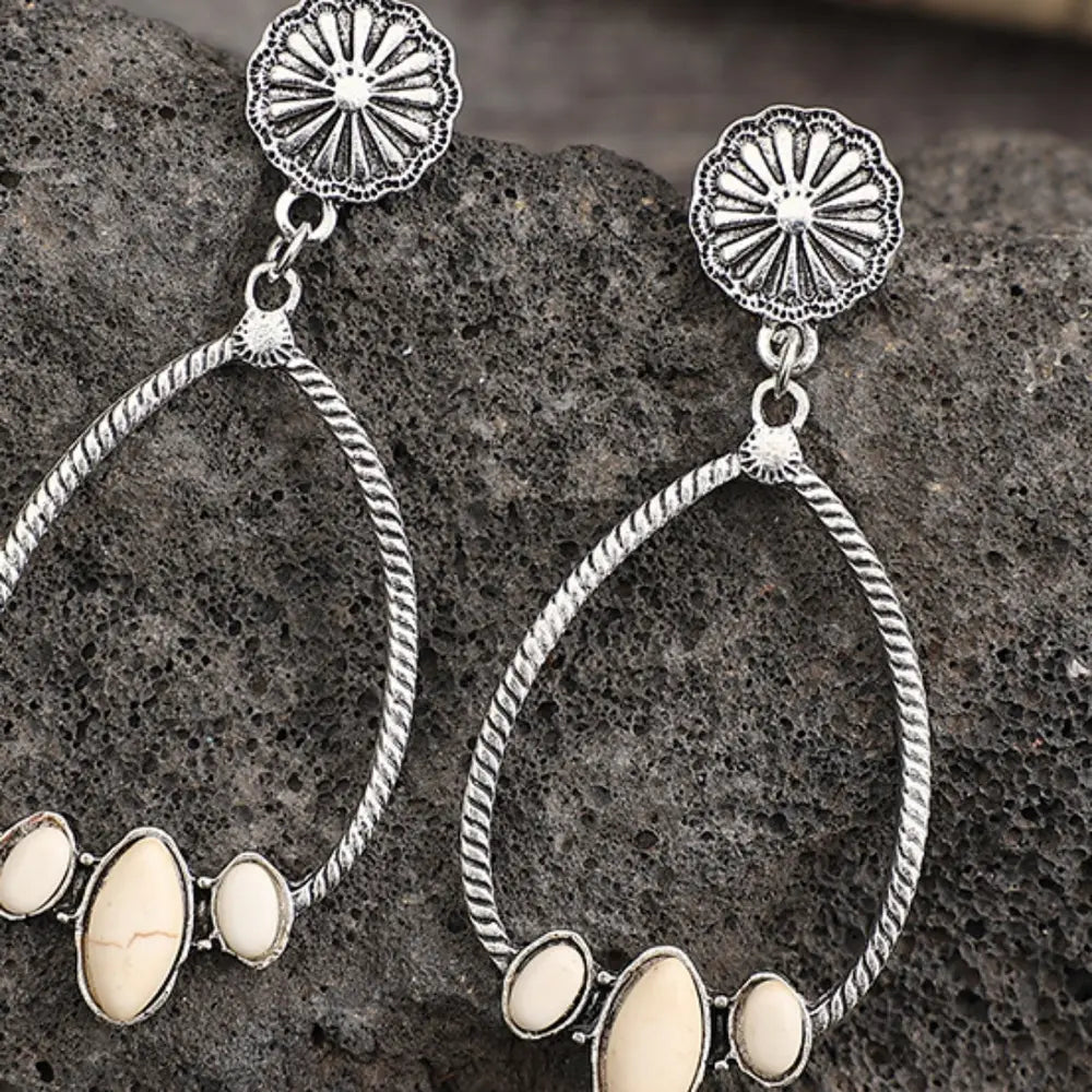 Southwestern teardrop earrings with ivory stones and silver alloy, featuring a boho design.