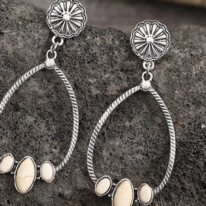 Southwestern teardrop earrings with ivory stones and silver alloy, featuring a boho design.