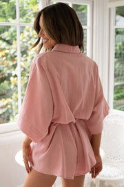 Dusty pink linen kimono sleeve romper with tie waist and collar detail