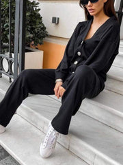 Black button-front lounge set with wide-leg pants and a V-neck cardigan.
