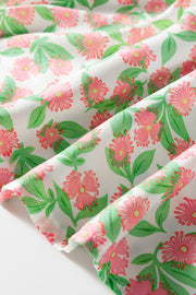 Women's tiered mini dress fabric with pink floral print and green leaves