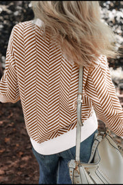 Chevron knit crewneck sweater in camel and white with a white ribbed hem.