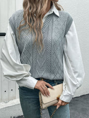 Gray diamond knit V-neck vest with openwork details, worn over a white shirt.