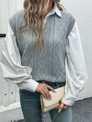 Gray diamond knit V-neck vest with openwork details, worn over a white shirt.