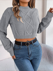 Cropped cable knit sweater in charcoal with mock neck and long sleeves.
