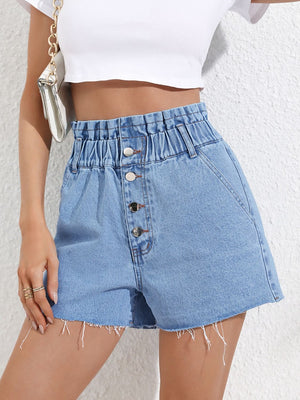 High-waisted denim paperbag shorts in medium wash with button fly and frayed hem.