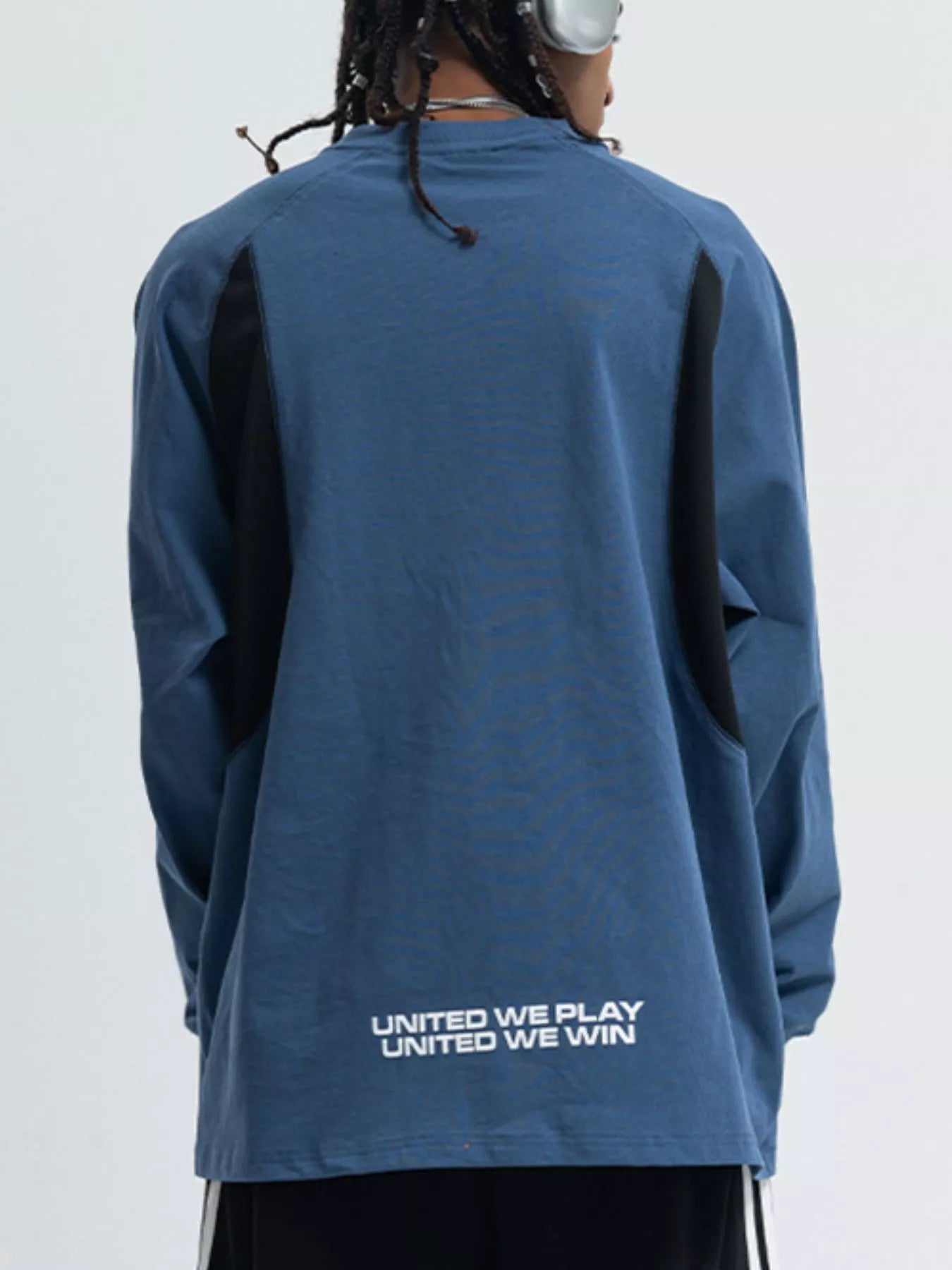Relaxed fit long-sleeve tee in royal blue with black contrast panels and text graphic on back.