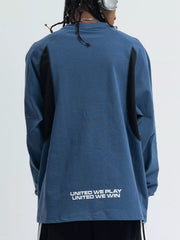 Relaxed fit long-sleeve tee in royal blue with black contrast panels and text graphic on back.