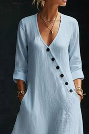 Light blue maxi dress with V-neck, button detail and cuffed sleeves.