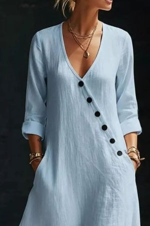 Light blue maxi dress with V-neck, button detail and cuffed sleeves.