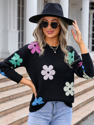 Black crewneck sweater with colorful floral print and long sleeves