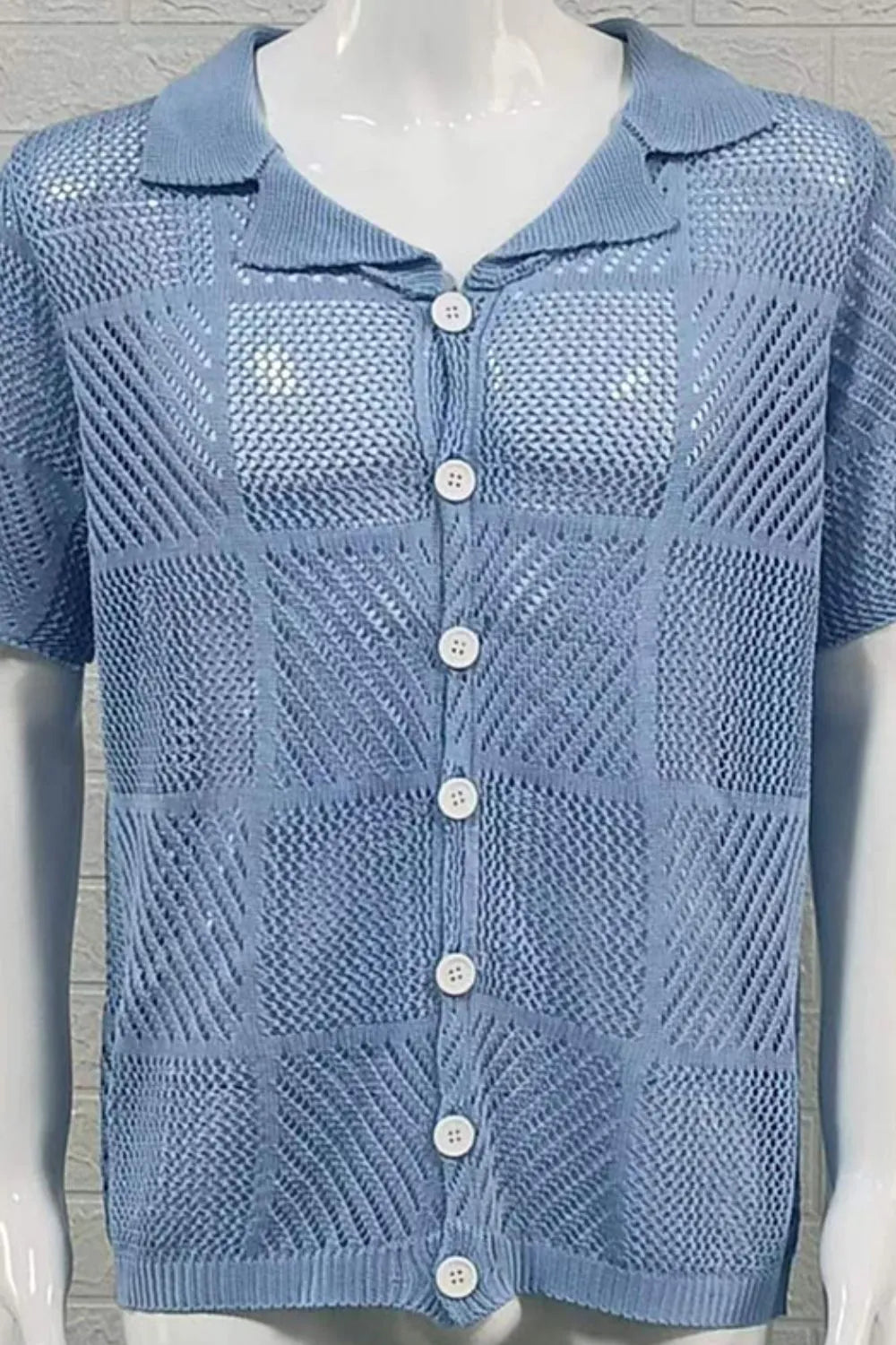 Light blue geometric knit polo shirt with button front and short sleeves