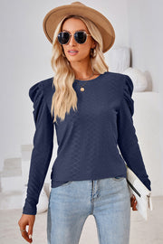 Dark blue textured puff-sleeve crew neck top with diamond pattern