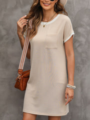 Beige striped t-shirt dress with crew neck, short sleeves, and chest pocket.