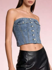 Strapless denim crop top with button detailing and raw hem