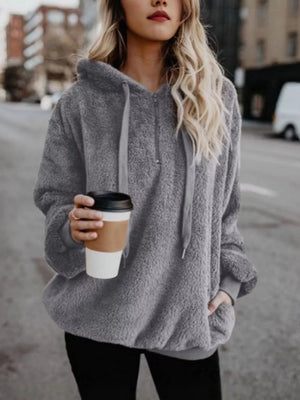 Gray fuzzy fleece half-zip hoodie with drawstring and pockets