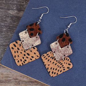 Textured leopard print drop earrings in tan and dark brown with square layered pendants.