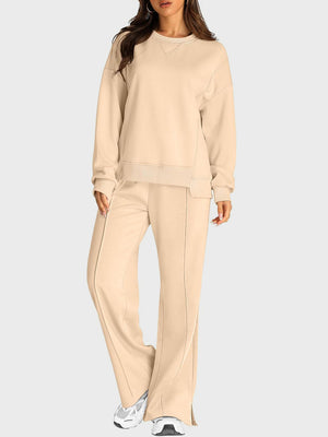 Tan seamed lounge set with crewneck sweatshirt and slit-front wide-leg trousers.