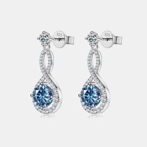 Infinity drop earrings with royal blue aquamarine and clear crystal accents.