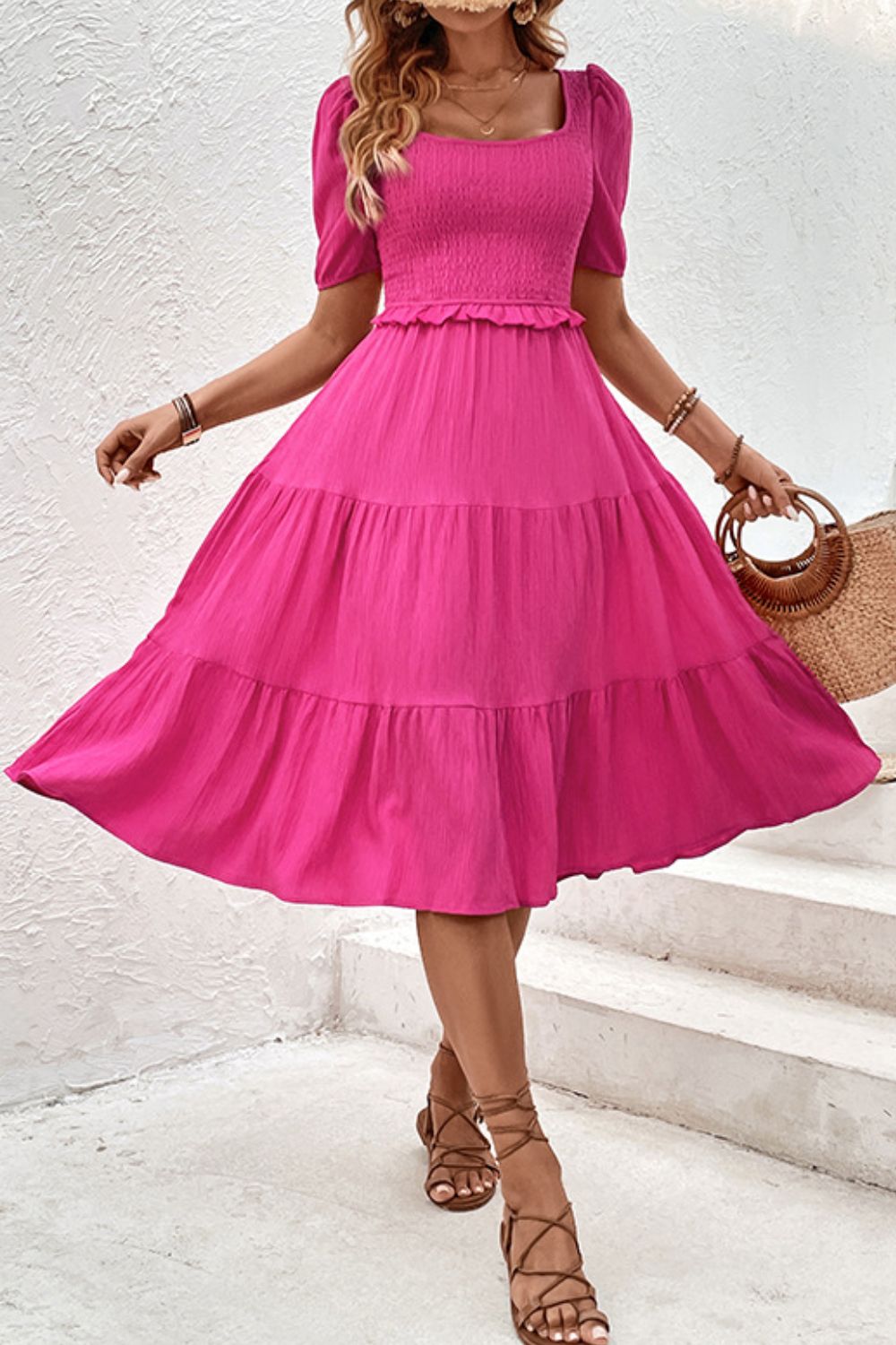 Hot pink midi dress with tiered ruffles, square neckline, puff sleeves, and smocked bodice.