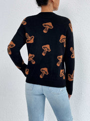 Black knit sweater with allover brown mushroom print, drop shoulder, and crew neck.