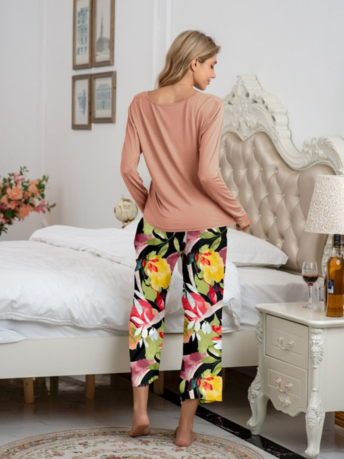 Botanical print lounge set with long sleeve top in dusty pink and cropped pants in vibrant floral pattern.