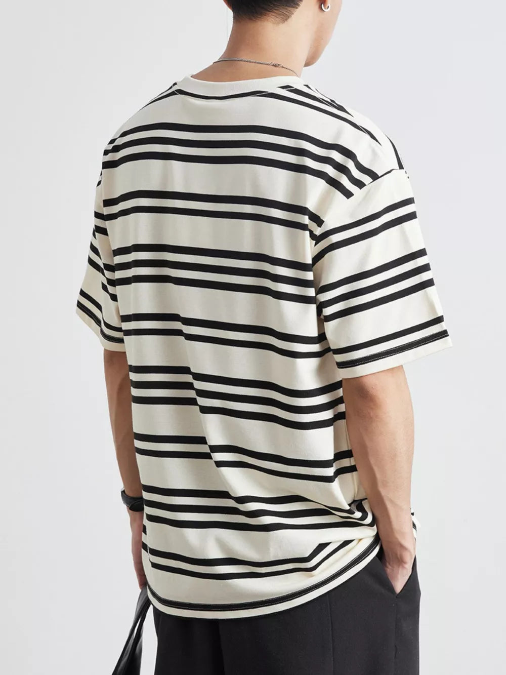 Men's striped cotton crew neck tee in cream with black horizontal stripes.